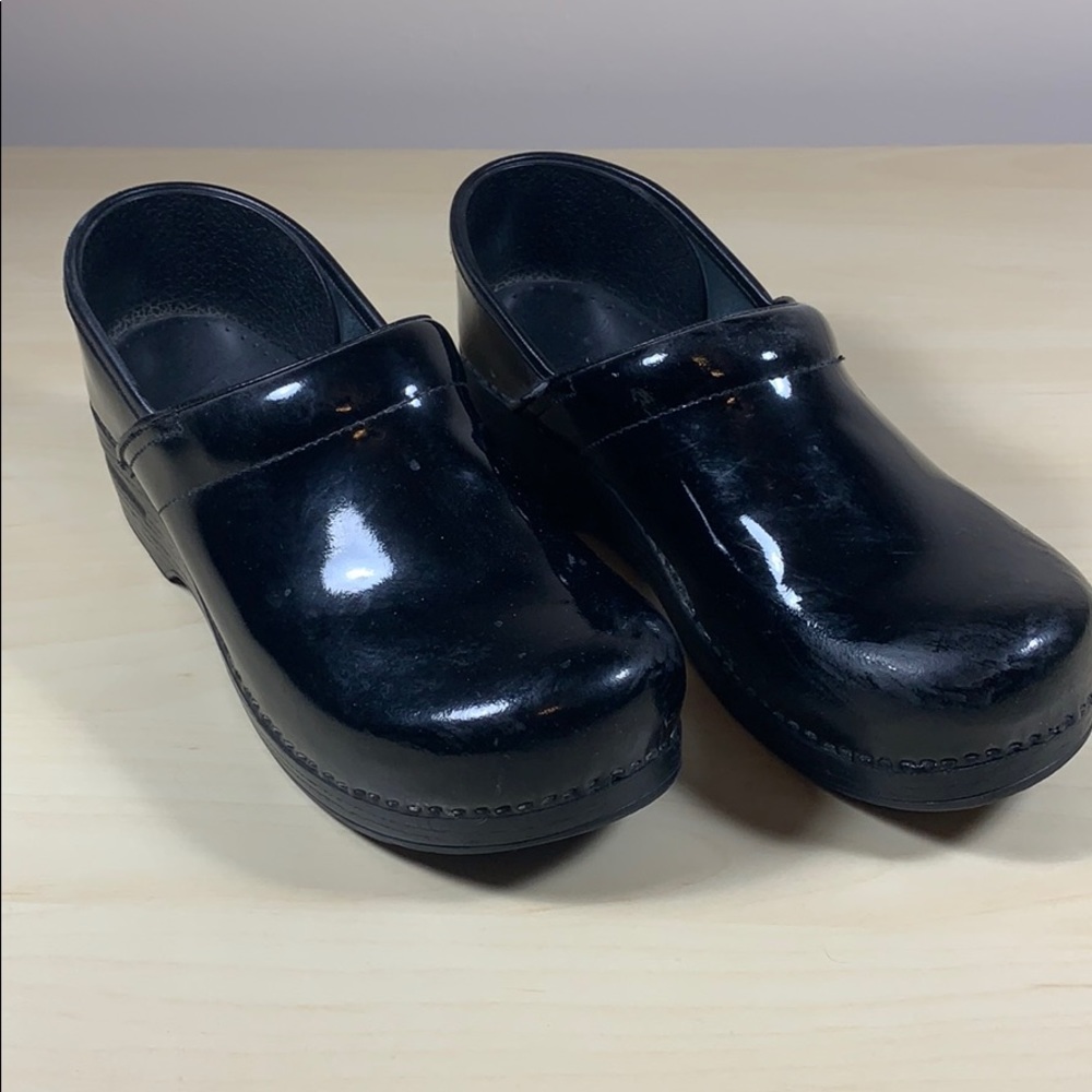 Dansko black patent clogs